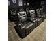 Home theater with multiple comfortable reclining seats and cup holders at 308 46Th W St, Bradenton, FL 34209