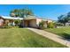 Condo exterior showcasing a brick facade and walkway at 3289 Fairhaven Ln # 112, Sarasota, FL 34239