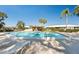 Relaxing community pool area with a pergola at 3289 Fairhaven Ln # 112, Sarasota, FL 34239