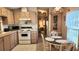 Functional kitchen with a dining area, offering a cozy space for meals and gatherings at 3333 26Th E Ave # 1195, Bradenton, FL 34208