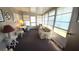 Bright sunroom with ample seating and windows at 3333 26Th E Ave # 1195, Bradenton, FL 34208