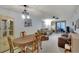 Bright dining room with table and chairs, adjacent to living room at 3634 Lake Bayshore Dr # 308, Bradenton, FL 34205