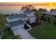 Stunning waterfront home with a large backyard, pool, and beautiful sunset views at 3804 Bayside Dr, Bradenton, FL 34210