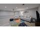 Relaxing basement recreation room with comfortable seating and water views at 3804 Bayside Dr, Bradenton, FL 34210