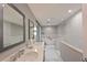 Elegant bathroom with double vanity, soaking tub, and walk-in shower at 3804 Bayside Dr, Bradenton, FL 34210