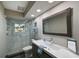 Elegant bathroom with a walk-in shower, floating vanity, and modern fixtures at 3804 Bayside Dr, Bradenton, FL 34210