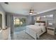 Spacious main bedroom with a king-size bed and stunning water views at 3804 Bayside Dr, Bradenton, FL 34210