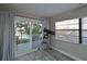 Bright bedroom with sliding glass doors leading to a deck and water views at 3804 Bayside Dr, Bradenton, FL 34210