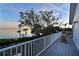 Spacious deck boasts stunning sunset views over the water at 3804 Bayside Dr, Bradenton, FL 34210