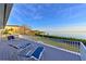 Spacious deck with stunning water views and lounge chairs at 3804 Bayside Dr, Bradenton, FL 34210