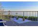 Relaxing deck overlooking the water with table and chairs at 3804 Bayside Dr, Bradenton, FL 34210