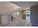 Open and airy entryway with a rustic barn door and modern staircase at 3804 Bayside Dr, Bradenton, FL 34210