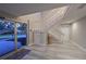 Bright and spacious entryway with a modern staircase and new flooring at 3804 Bayside Dr, Bradenton, FL 34210
