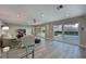 Spacious living room with sliding doors leading to the pool and waterfront views at 3804 Bayside Dr, Bradenton, FL 34210