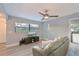 Relaxing living room with light gray walls, hardwood floors, and a comfy leather sofa at 3804 Bayside Dr, Bradenton, FL 34210