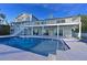 Inviting pool area with large deck and multi-level home at 3804 Bayside Dr, Bradenton, FL 34210