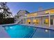 Stunning pool and home view at dusk at 3804 Bayside Dr, Bradenton, FL 34210