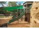 Close-up view of a playground slide and climbing wall at 3931 Longhorn Dr, Sarasota, FL 34233