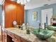 Elegant bathroom with dual vanities and a vessel sink at 4002 Wilshire E Cir # 90, Sarasota, FL 34238