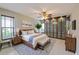 Stylishly furnished bedroom featuring a decorative ceiling fan and a glass door closet at 4002 Wilshire E Cir # 90, Sarasota, FL 34238