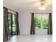 Bright bedroom with large windows and sliding glass door at 4002 Wilshire E Cir # 90, Sarasota, FL 34238
