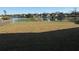 Large backyard with lake view and partial grass at 4042 Kingsfield Dr, Parrish, FL 34219