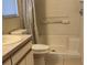 Bathroom with shower/tub combo, vanity with sink, and neutral tile at 4042 Kingsfield Dr, Parrish, FL 34219
