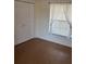 Bedroom with wood flooring and double door closet at 4042 Kingsfield Dr, Parrish, FL 34219
