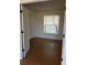 Bright bedroom with wood flooring and double doors to closet at 4042 Kingsfield Dr, Parrish, FL 34219