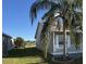 Gray house with white porch and palm tree in the yard at 4042 Kingsfield Dr, Parrish, FL 34219