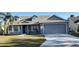 Gray two-story house with a two-car garage and a porch at 4042 Kingsfield Dr, Parrish, FL 34219