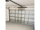 White garage door and interior view of garage at 4042 Kingsfield Dr, Parrish, FL 34219