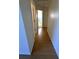 Hallway with wood flooring leading to bedrooms at 4042 Kingsfield Dr, Parrish, FL 34219