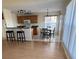 Kitchen with light wood cabinets and a dining area at 4042 Kingsfield Dr, Parrish, FL 34219