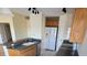 Kitchen with wood cabinets, granite countertops, and a white refrigerator at 4042 Kingsfield Dr, Parrish, FL 34219