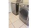 Laundry room with LG washer and dryer; tiled floor at 4042 Kingsfield Dr, Parrish, FL 34219