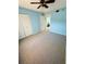 Bedroom with double door closet and ceiling fan at 4110 Ironwood Circle Cir # 204, Bradenton, FL 34209