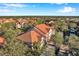Aerial view of a community with multiple buildings, lush landscaping, and a tranquil atmosphere at 4140 Central Sarasota Pkwy # 1233, Sarasota, FL 34238