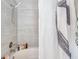 Clean bathroom with a bathtub and shower, tiled walls, and a shower at 4140 Central Sarasota Pkwy # 1233, Sarasota, FL 34238