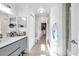 Bathroom with gray vanity, toilet, and access to laundry at 4140 Central Sarasota Pkwy # 1233, Sarasota, FL 34238