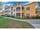 Exterior of a building with balconies and landscaping, showcasing a peaceful atmosphere at 4140 Central Sarasota Pkwy # 1233, Sarasota, FL 34238