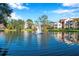 Scenic community pond featuring a fountain and reflecting the surrounding buildings at 4140 Central Sarasota Pkwy # 1233, Sarasota, FL 34238