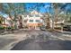 Condo building with parking and lush landscaping at 4140 Central Sarasota Pkwy # 1233, Sarasota, FL 34238