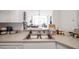 Clean kitchen featuring a double sink and neutral countertops at 4140 Central Sarasota Pkwy # 1233, Sarasota, FL 34238