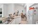 Bright kitchen with ample counter space and white cabinets at 4140 Central Sarasota Pkwy # 1233, Sarasota, FL 34238