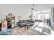 Spacious living room with a comfortable sectional sofa and large windows at 4140 Central Sarasota Pkwy # 1233, Sarasota, FL 34238