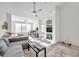 Sunlit living room featuring a sectional sofa and high ceilings at 4140 Central Sarasota Pkwy # 1233, Sarasota, FL 34238