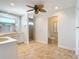 A bathroom with tile floors, and sinks, a walk-in shower and separate water closet at 4440 Tatum St, Port Charlotte, FL 33948