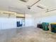 Spacious garage with ample storage space, overhead lighting, and an electric garage door opener at 4440 Tatum St, Port Charlotte, FL 33948