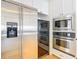 Stainless steel refrigerator and oven enhance the modern kitchen at 4440 Tatum St, Port Charlotte, FL 33948